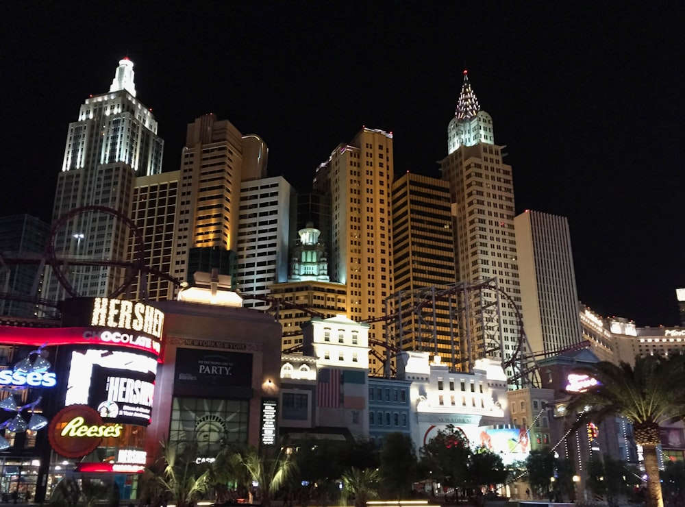 a city at night with a lot of tall buildings