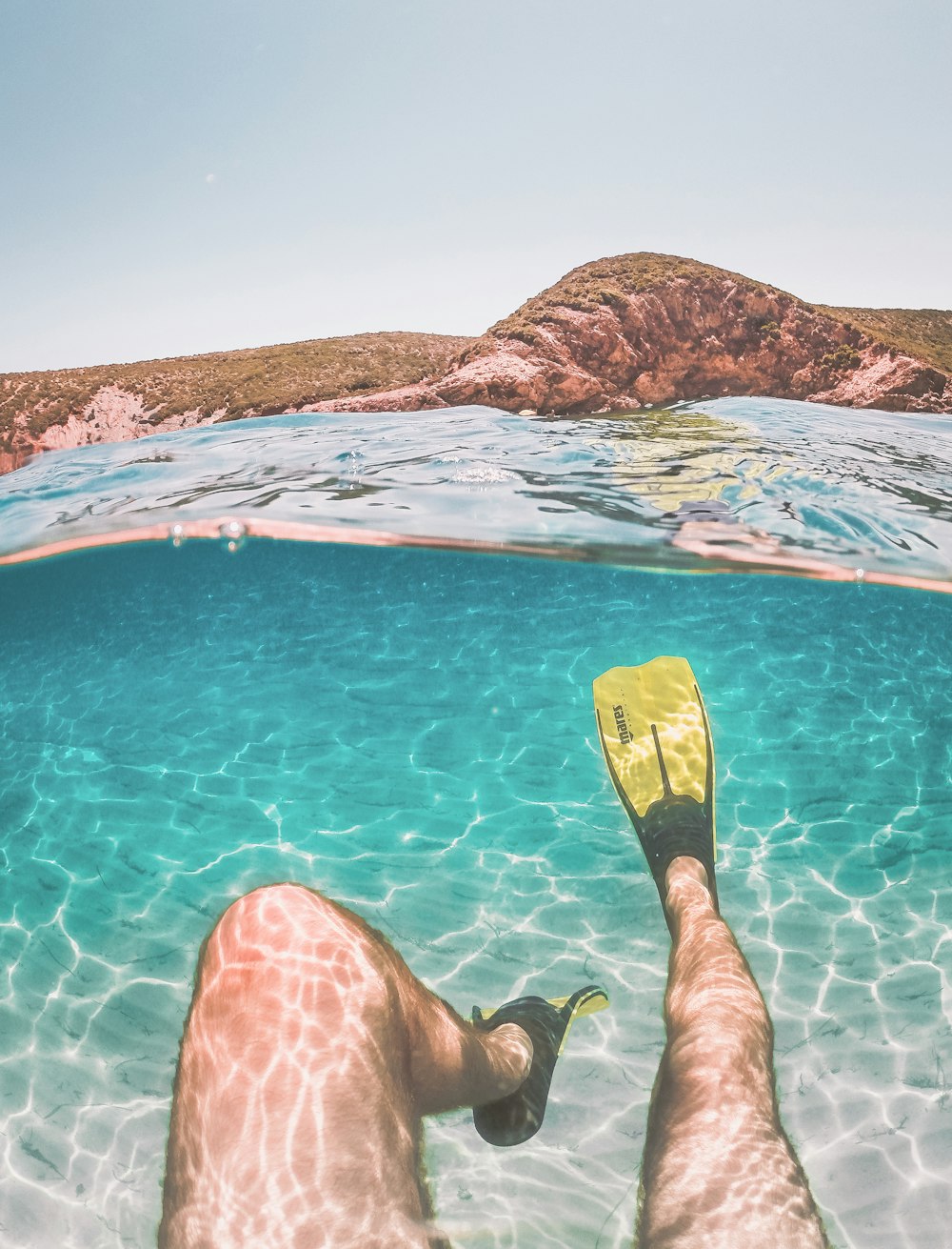 a person with their feet in the water