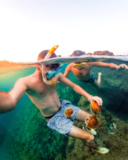 a couple of people that are in the water