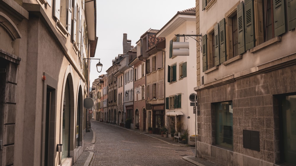 a narrow street in a european city with old buildings