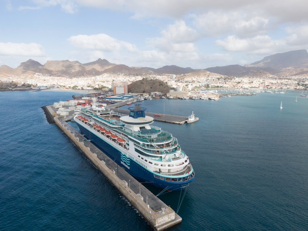 a cruise ship docked at a dock in the ocean