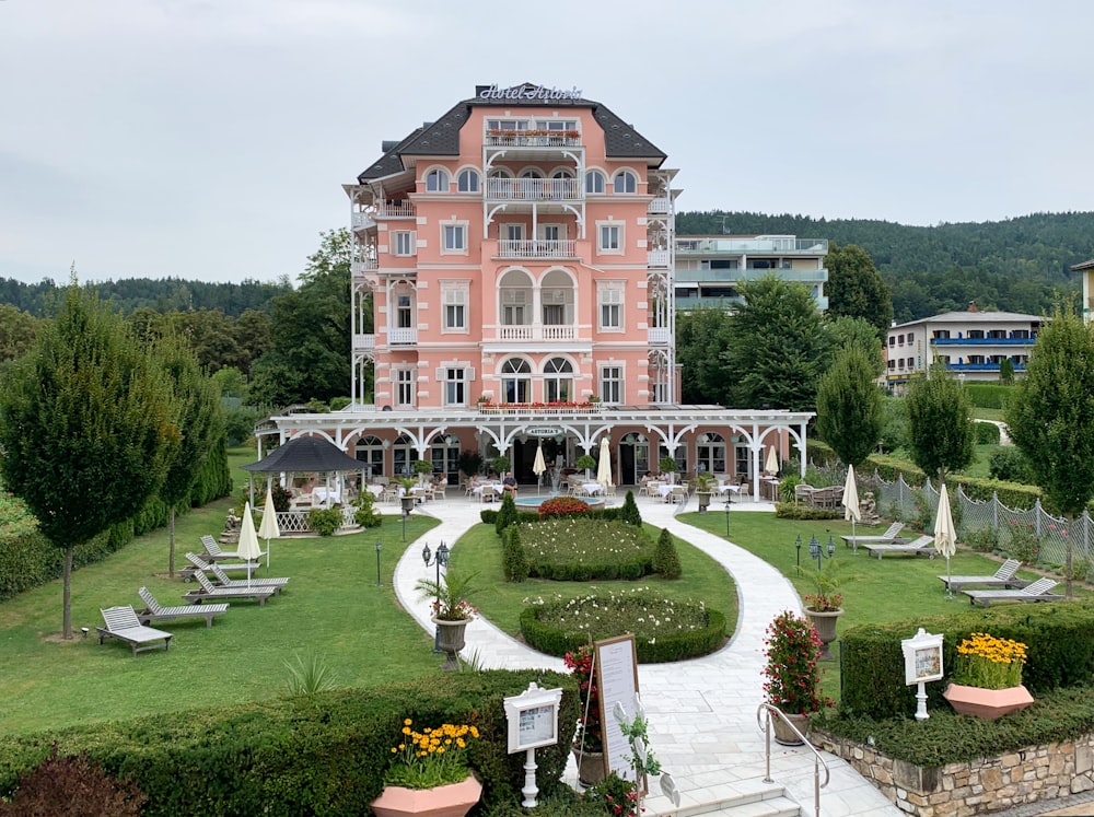 a large building with a garden in front of it