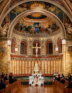 a couple of people that are sitting in a church