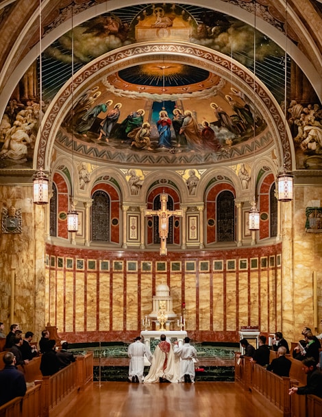 a couple of people that are sitting in a church