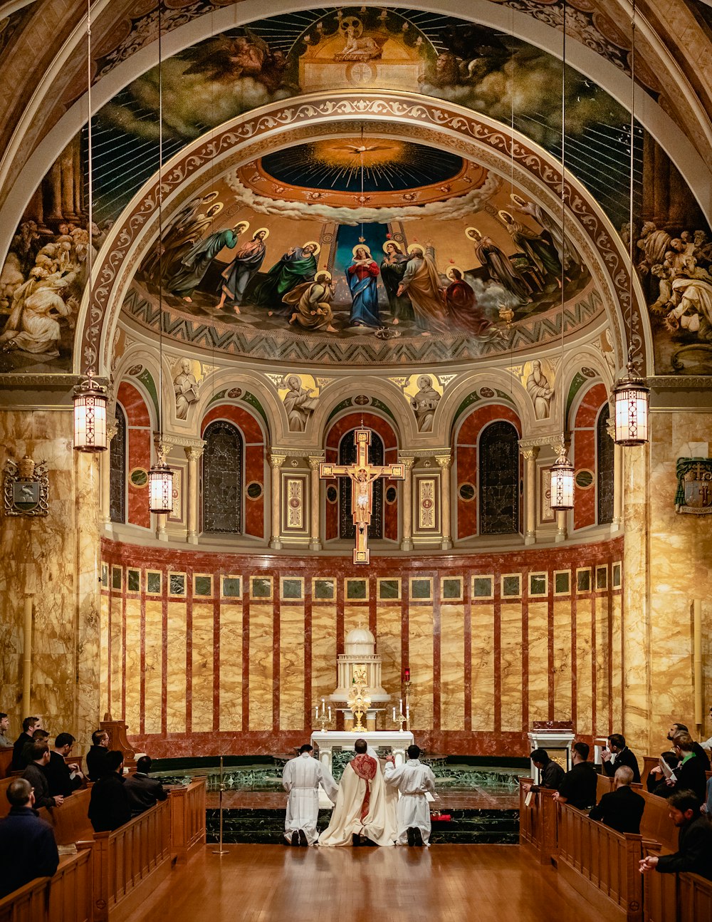 a couple of people that are sitting in a church