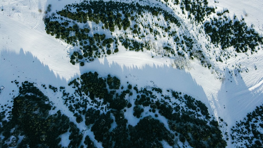 an aerial view of a snow covered mountain