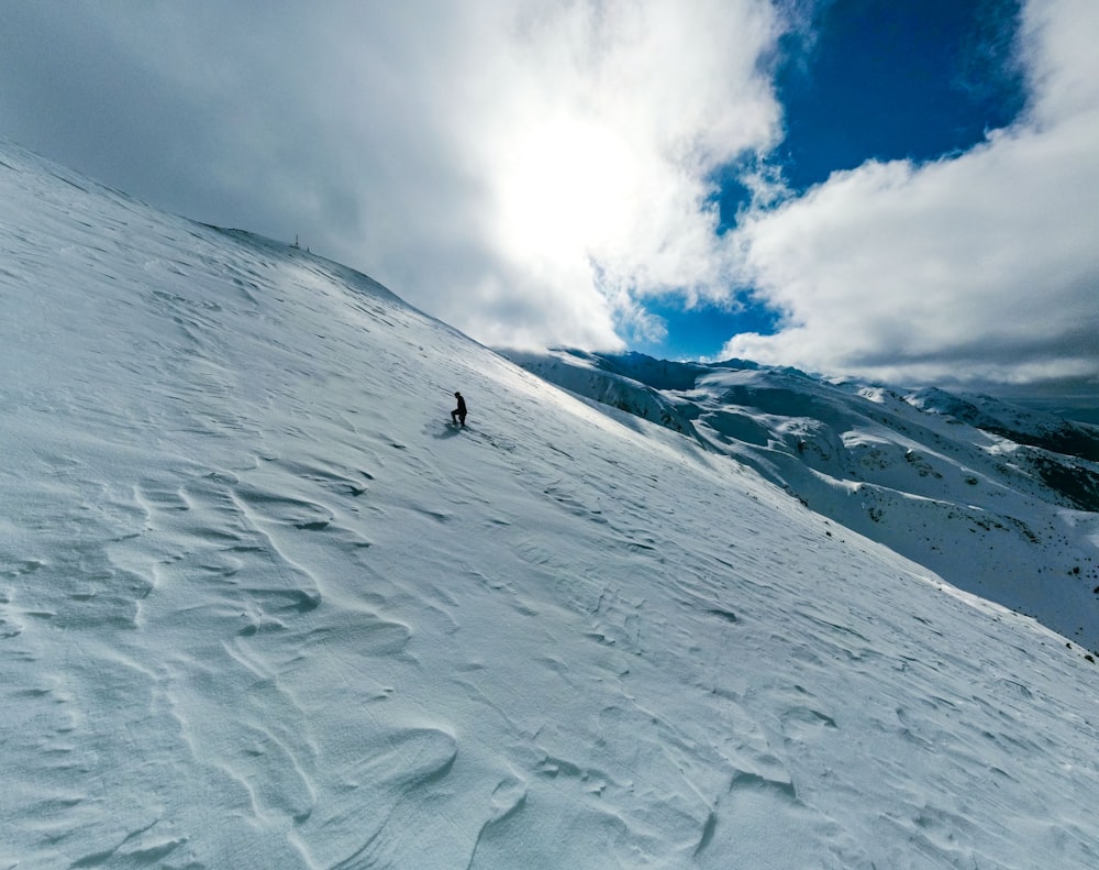 a person skiing down a snow covered mountain