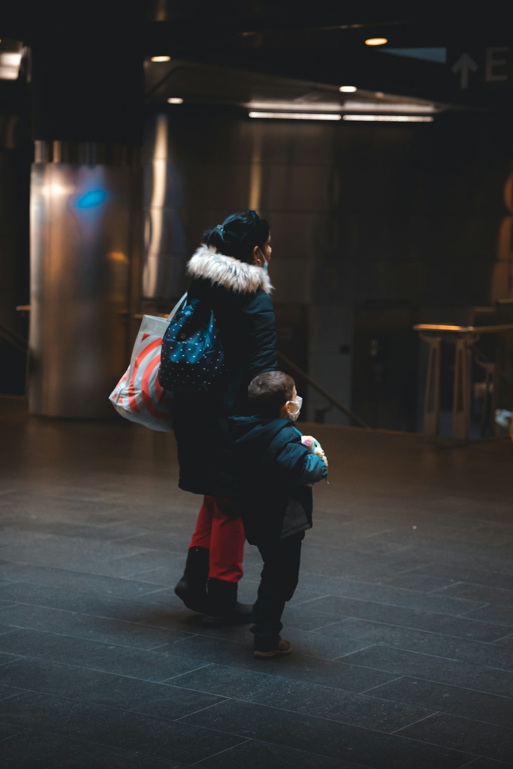 a woman holding a baby in her arms