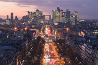 a view of a city at night from the top of a building