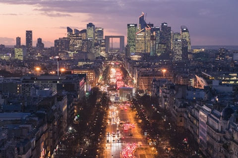 a view of a city at night from the top of a building