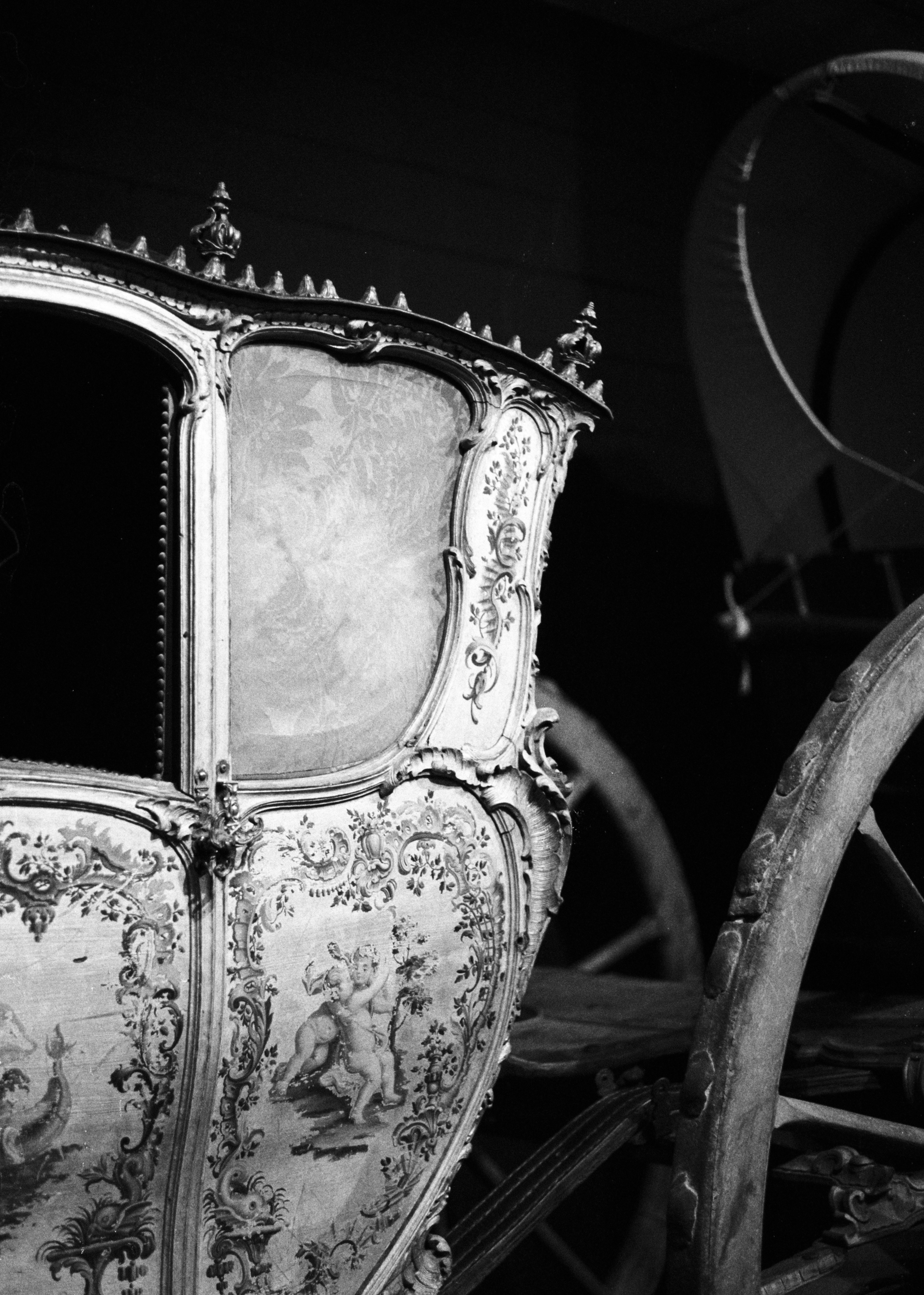 a horse drawn carriage in a black and white photo
