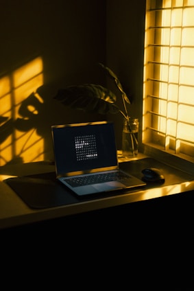 a laptop computer sitting on top of a desk