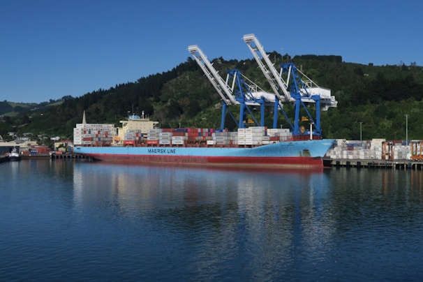 a large cargo ship docked at a dock