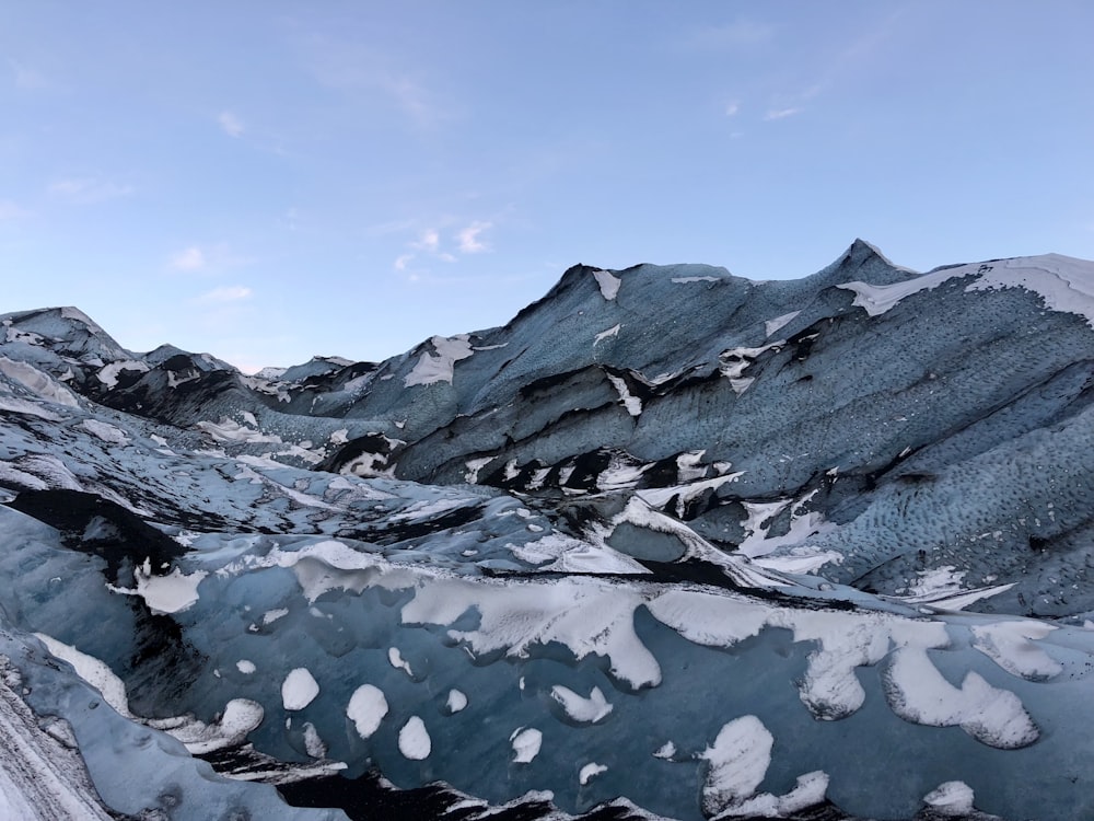 a view of a mountain range covered in snow