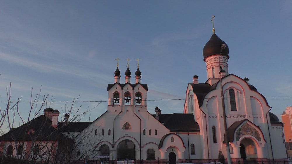 a large white church with a black roof