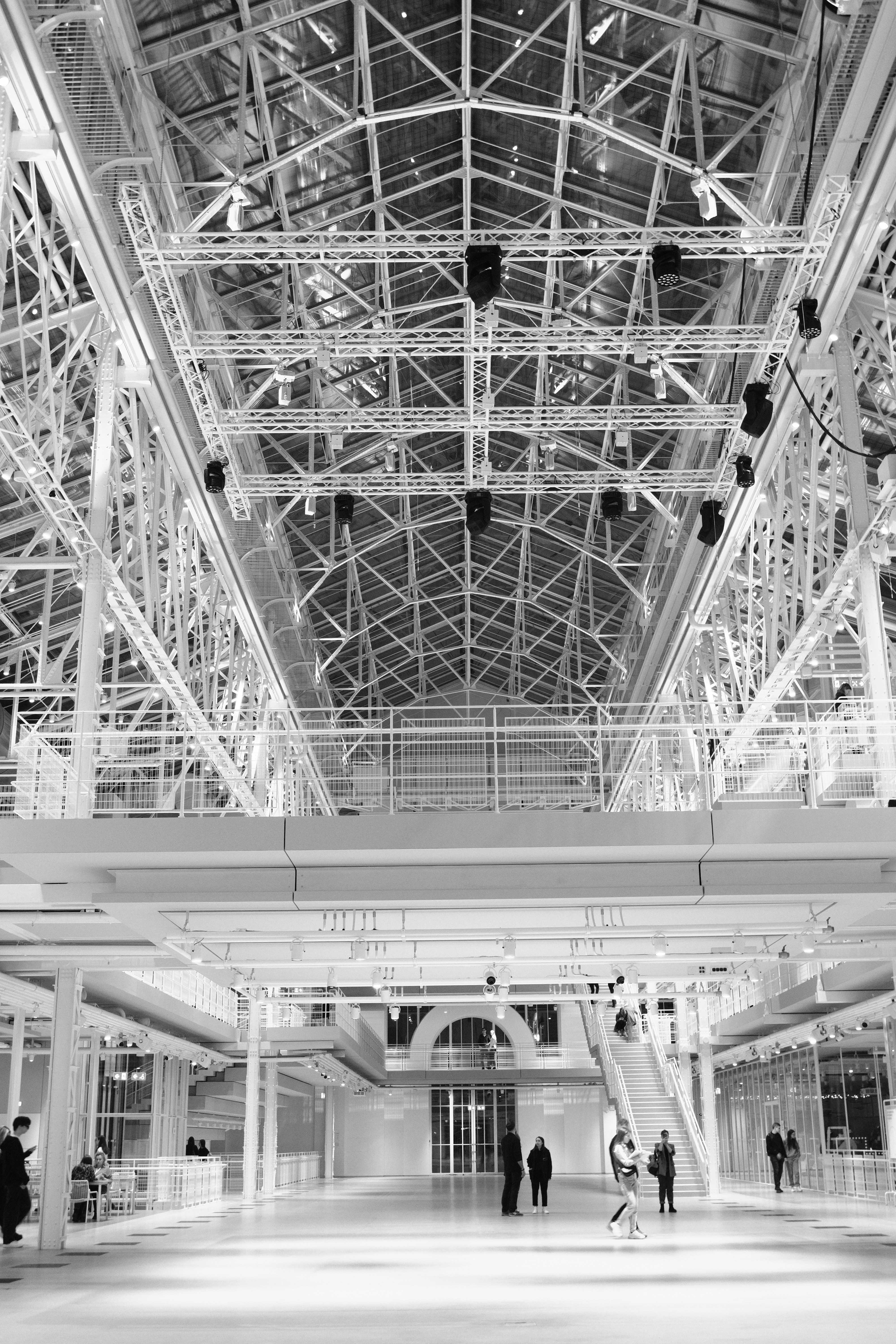 a black and white photo of people in a building