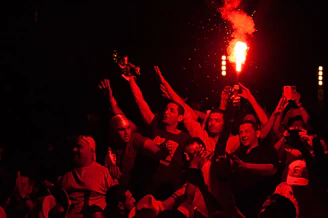 A lively group photo of La Flèche Étaploise members celebrating after a community event.