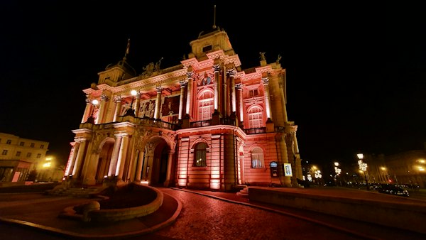 The National Theatre lit at night — Zagreb, Croatia