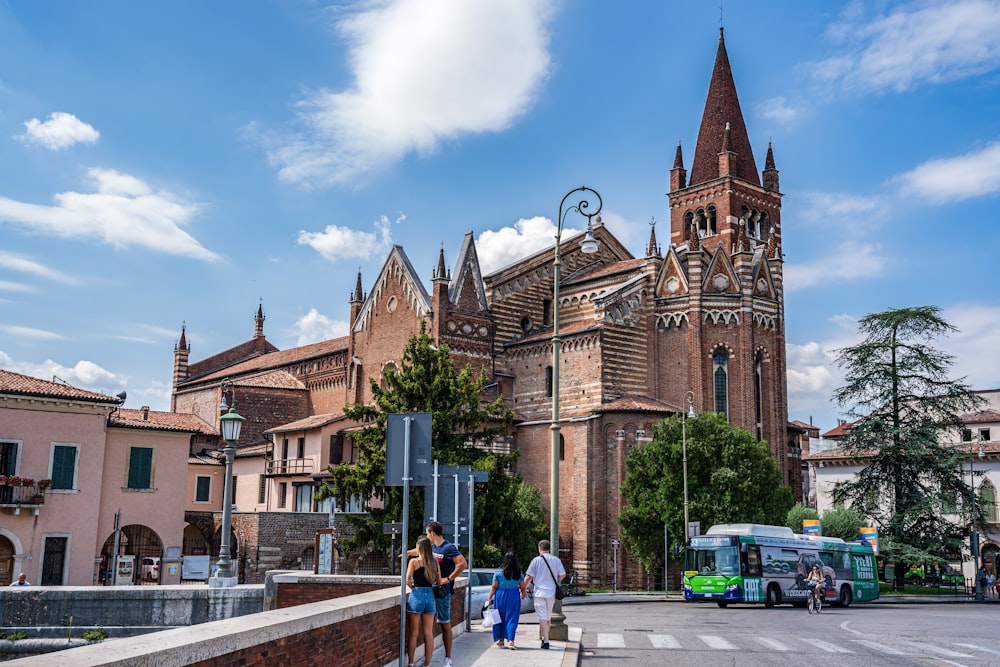 a group of people standing in front of a church