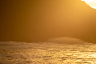 A gentle meditation session by the ocean with soft waves and golden light.