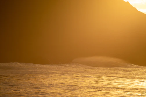 A gentle meditation session by the ocean with soft waves and golden light.