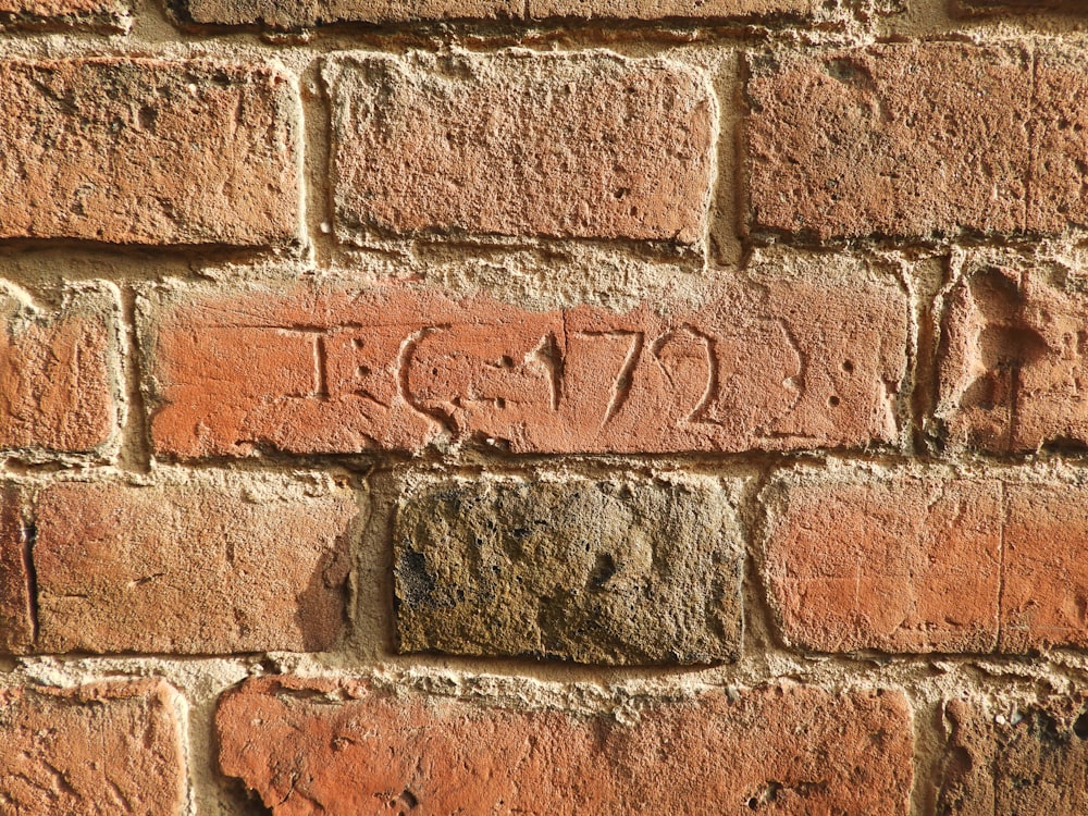 a brick wall with the word love written on it
