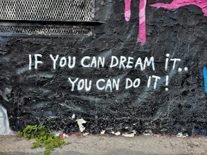graffiti on a wall that says if you can dream it, you can do it