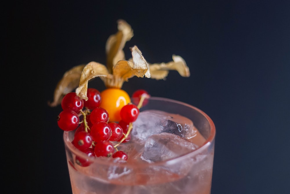 a close up of a drink in a glass with ice