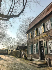 Photo of the Suttner GmbH office building at Alkenbrede 1, Lemgo, bathed in morning light.