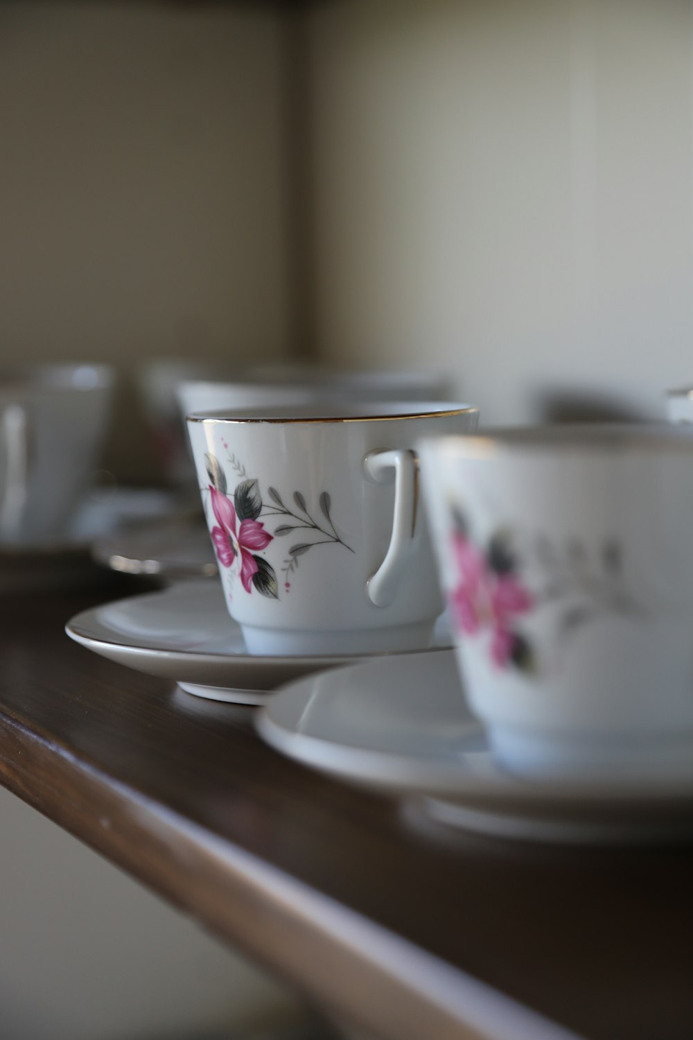 a close up of a cup and saucer on a table