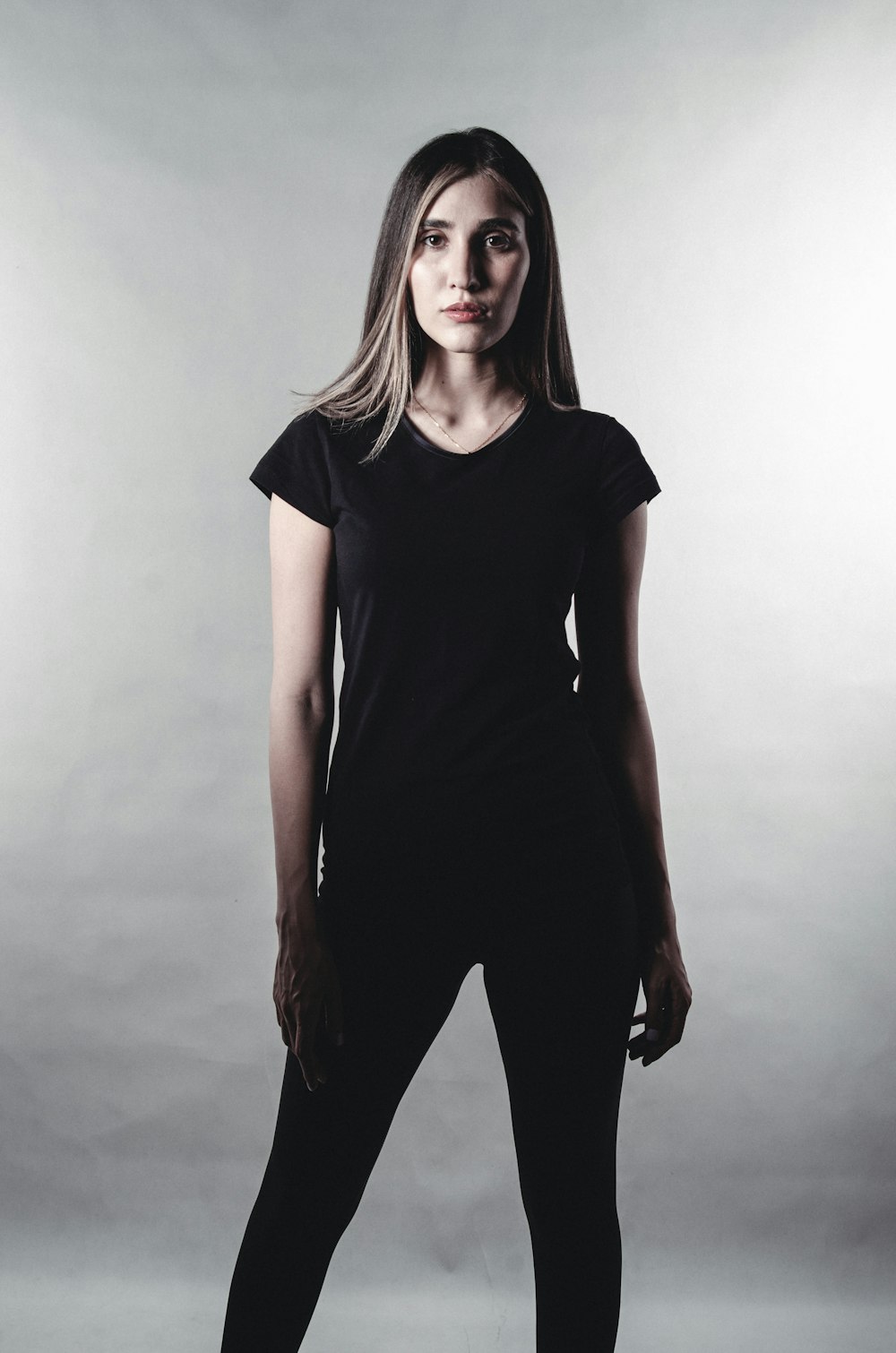 a woman posing for a picture in a black shirt