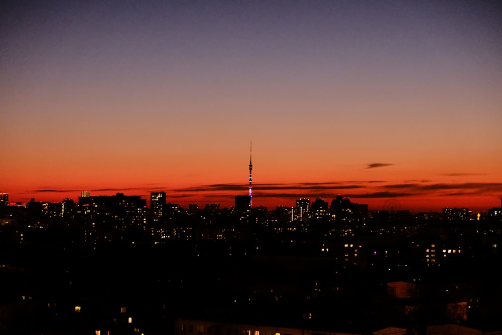 a view of a city skyline at sunset