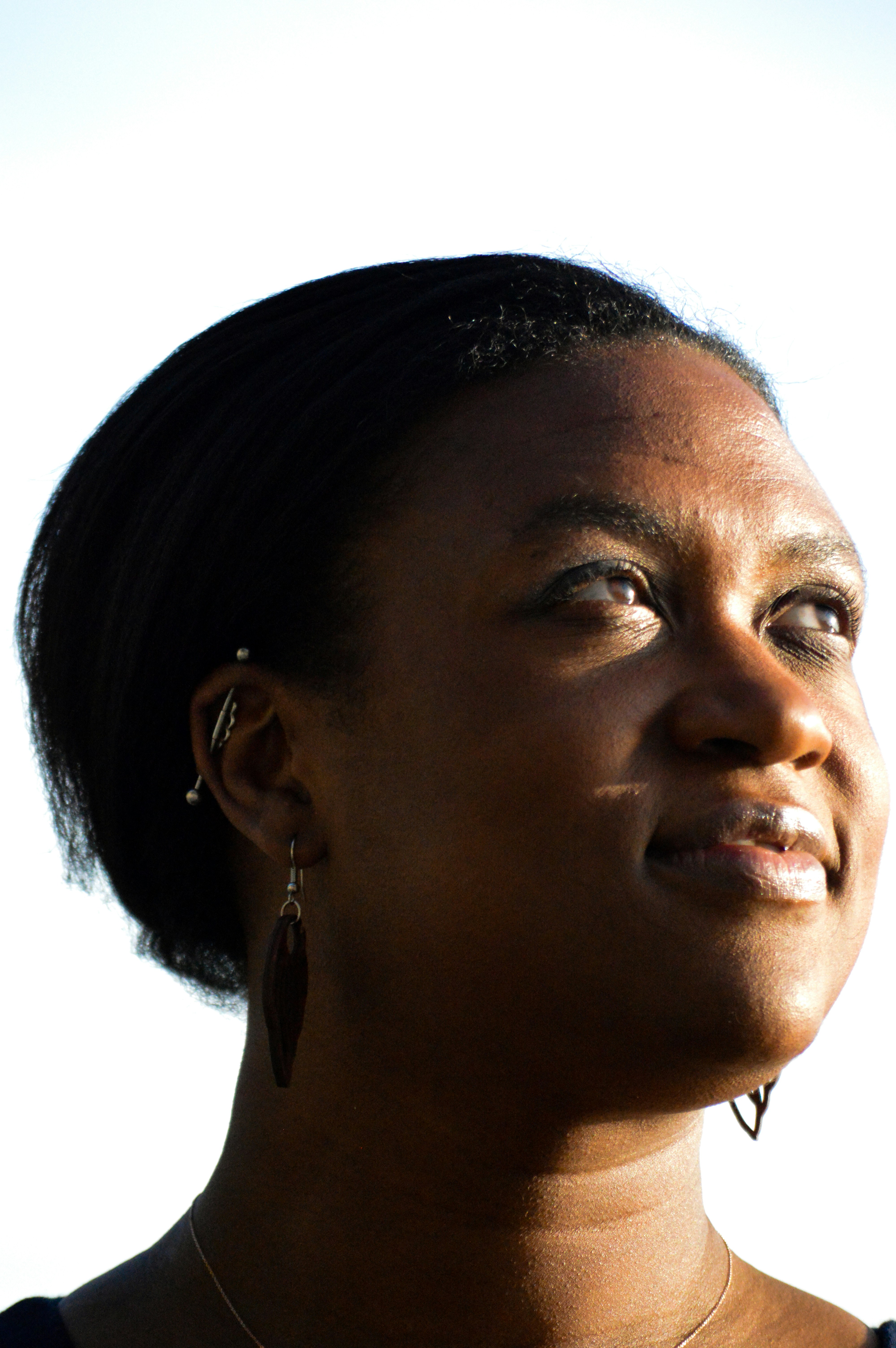 a close up of a person wearing a necklace