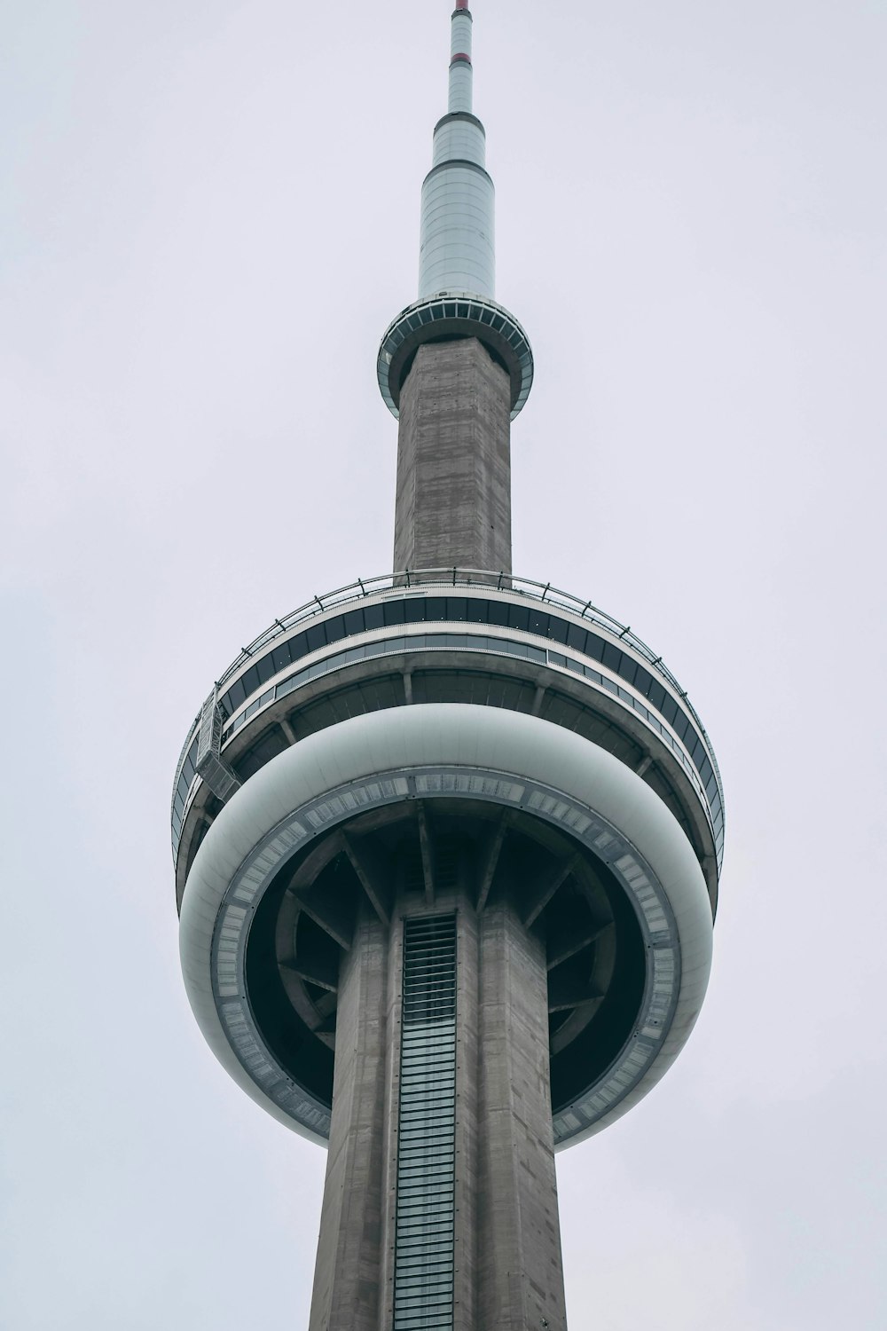 a very tall tower with a clock on it's side