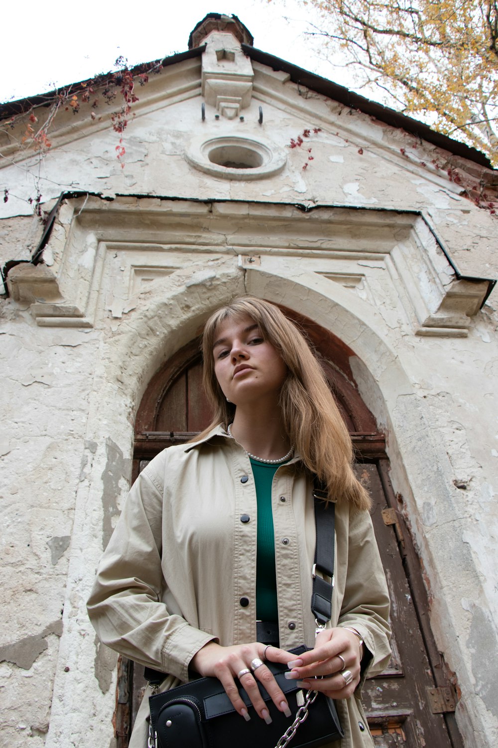 a woman standing in front of a building