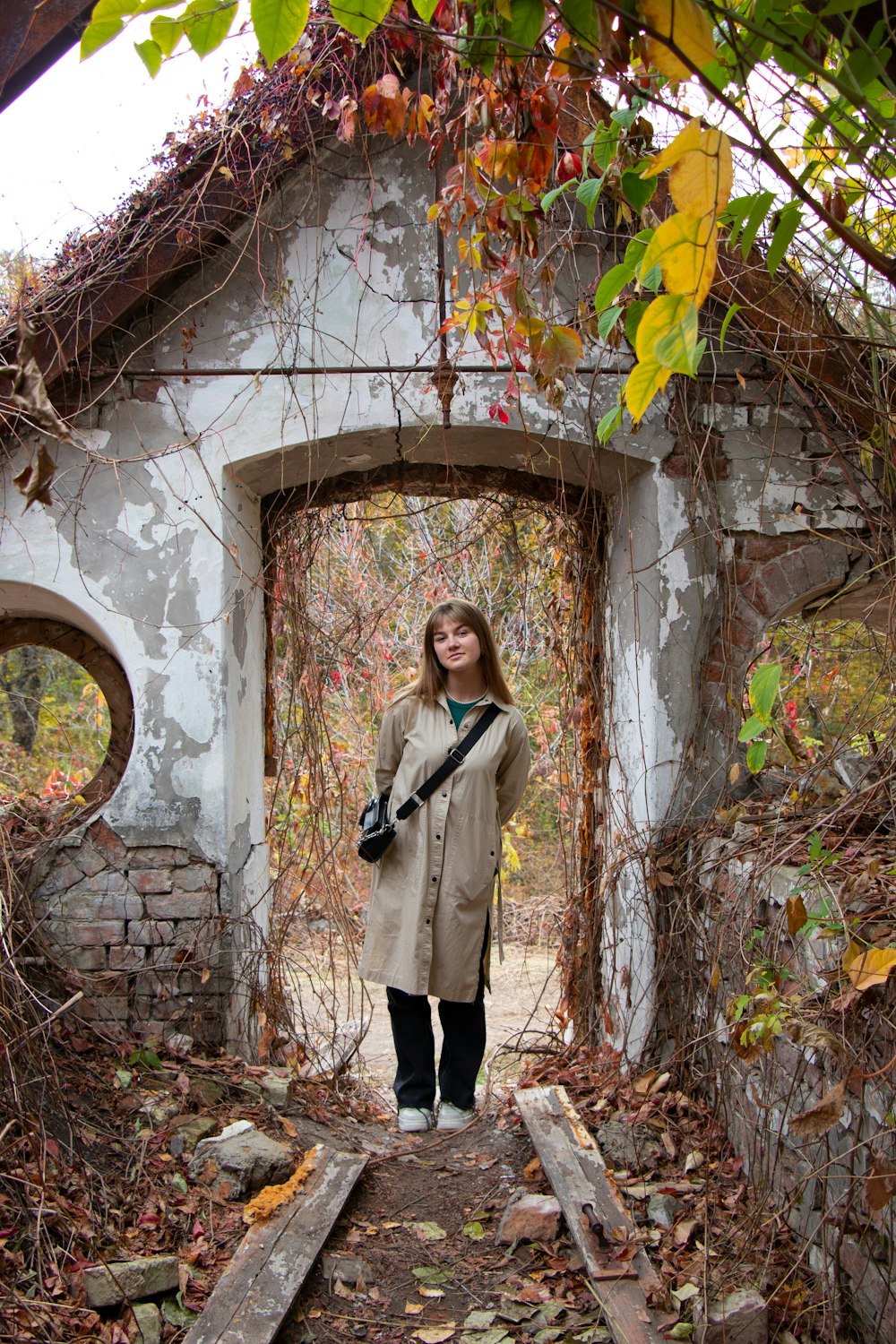 a woman standing in front of an old building