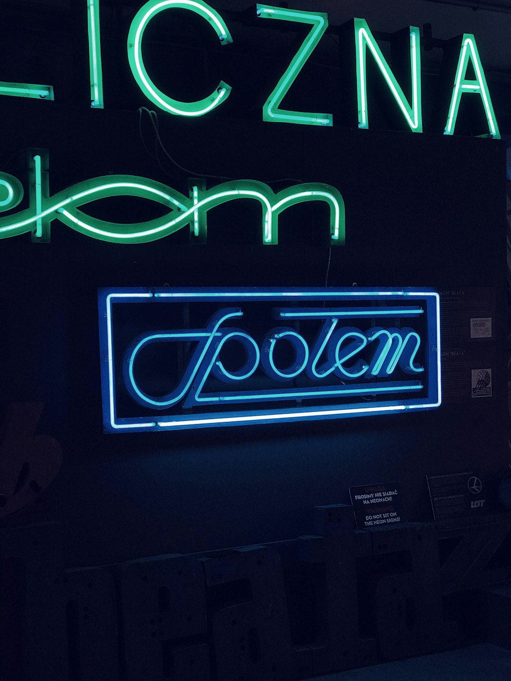 a neon sign that reads iczna bloom and a neon sign that says f