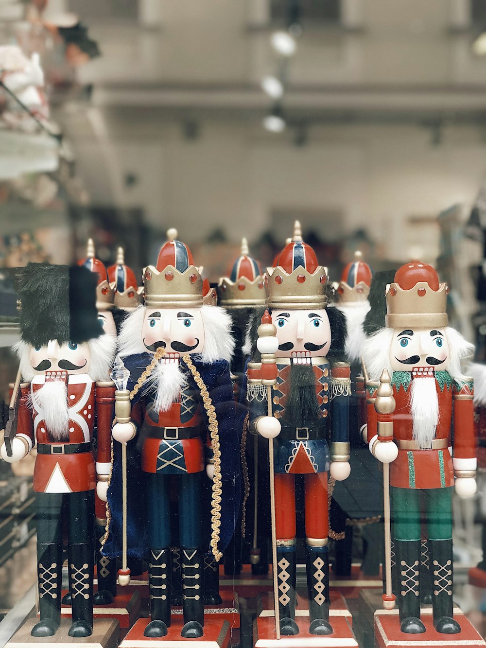 a group of nutcrackers in a store window