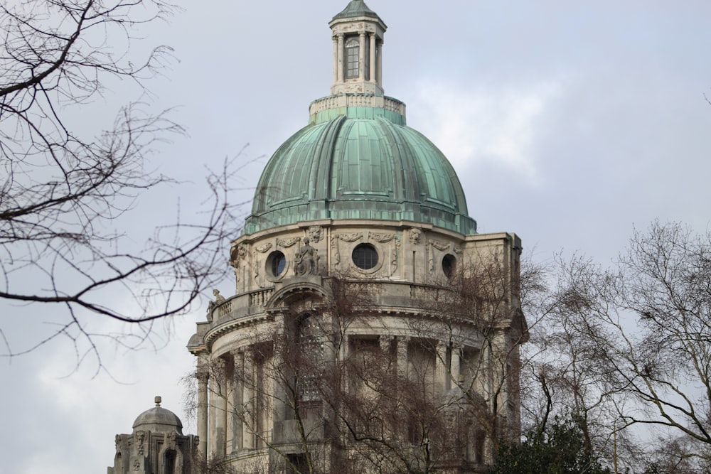 a large building with a green dome on top