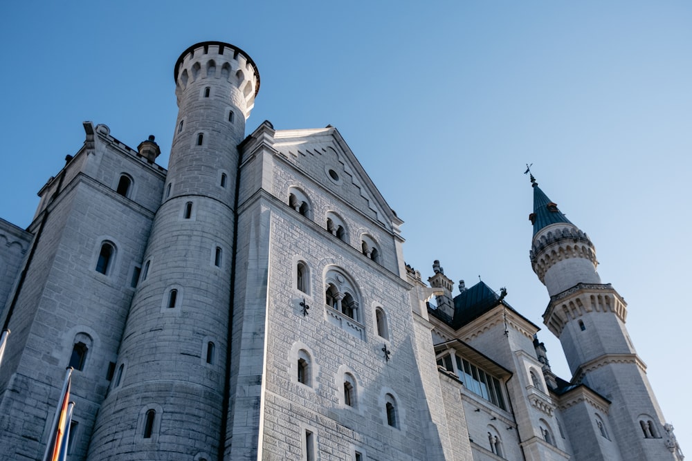 a tall castle with a clock on the front of it