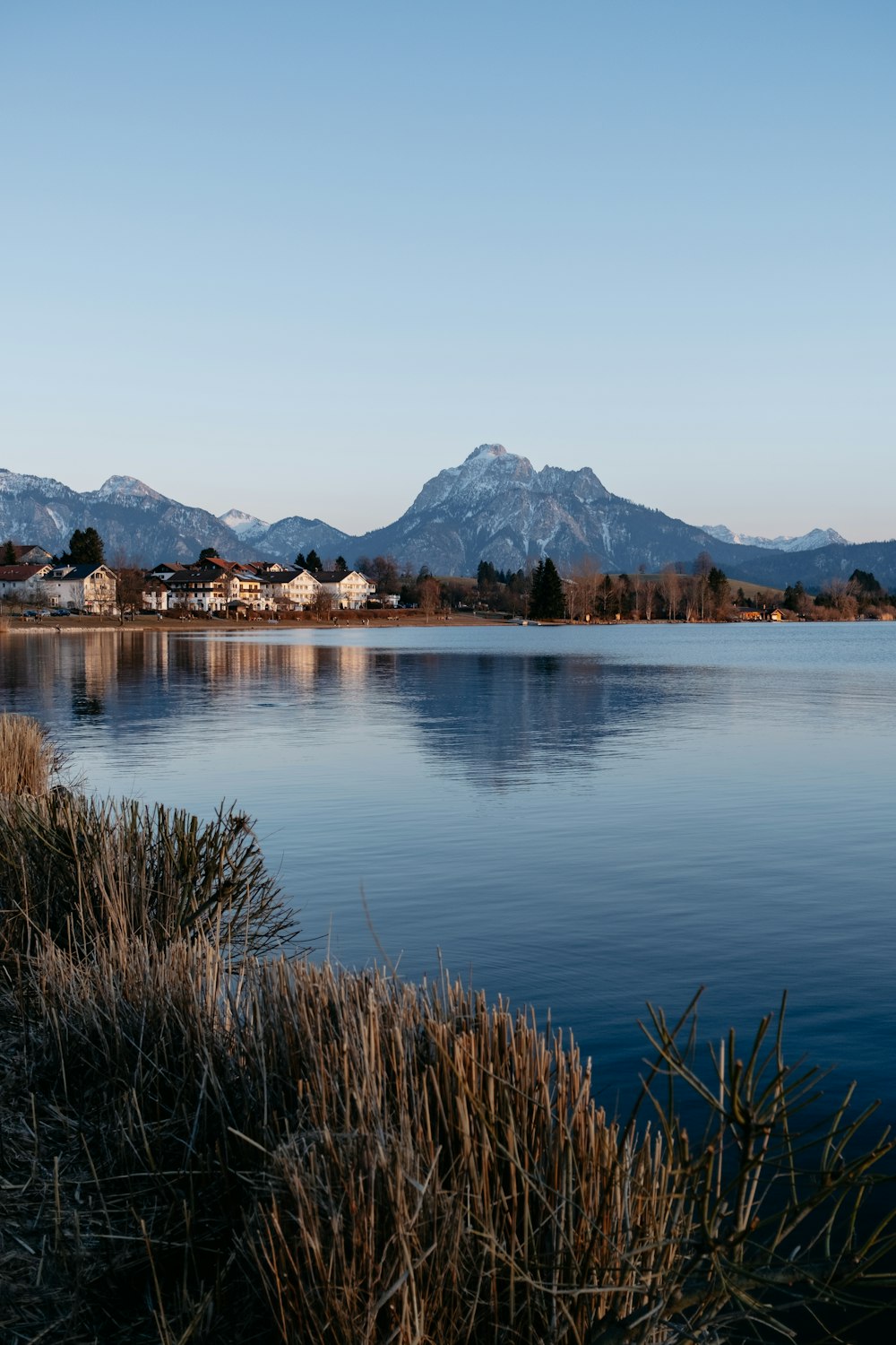 a body of water with mountains in the background