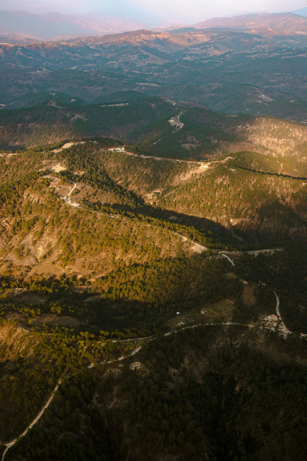 an aerial view of a valley and mountains