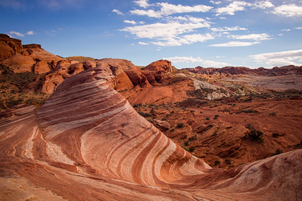 a large rock formation in the middle of a desert