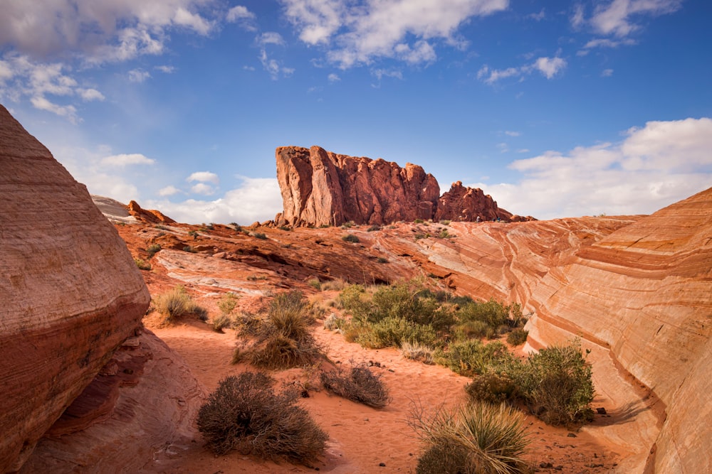 a large rock formation in the middle of a desert