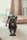 A playful fluffy French bulldog puppy exploring a modern Dallas apartment with city views.