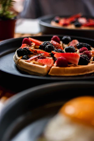 a close up of a pizza on a plate on a table