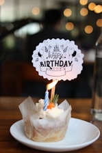 a birthday cupcake with a candle sticking out of it