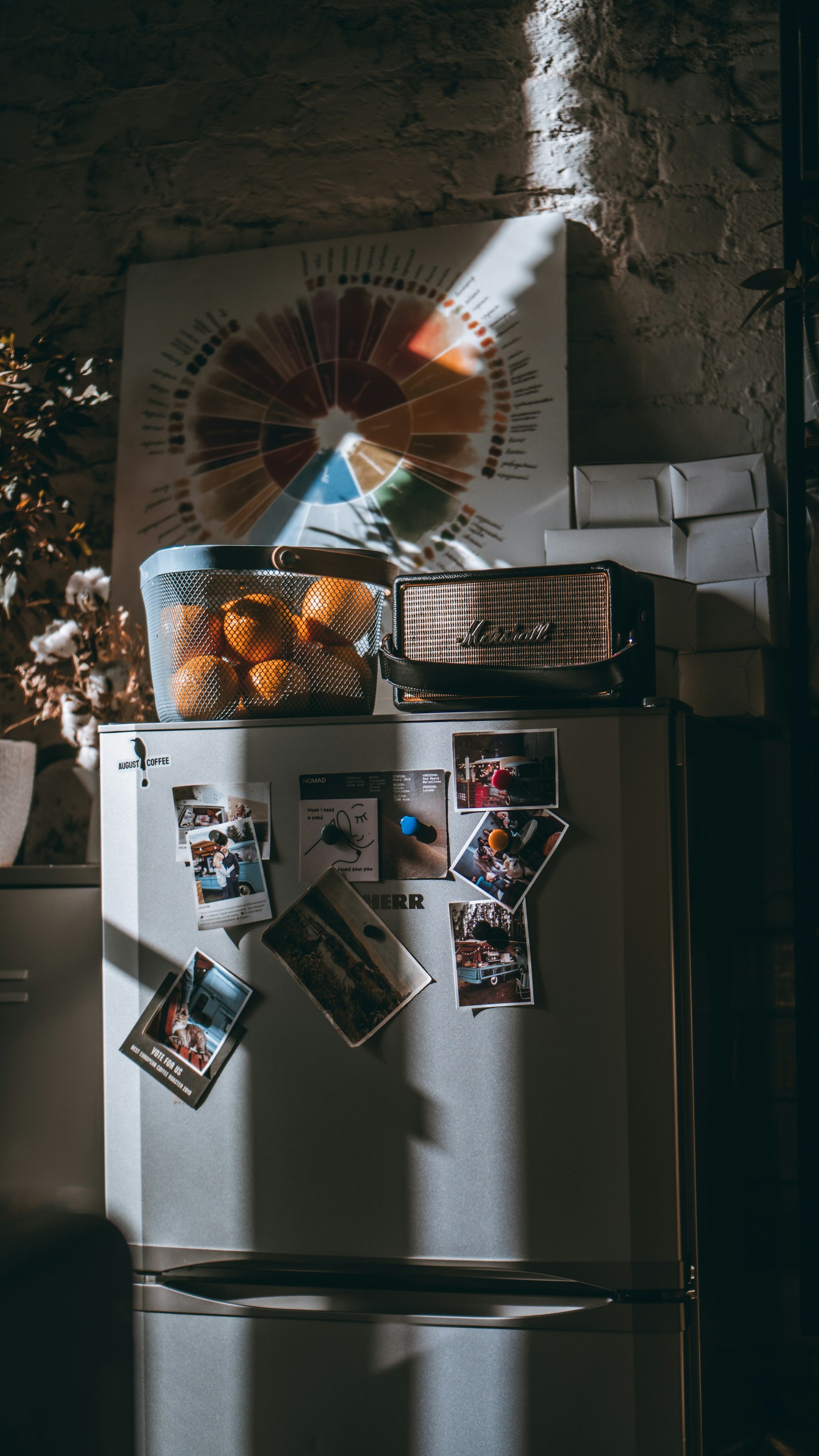 A refrigerator door covered in magnets, papers, and family notes