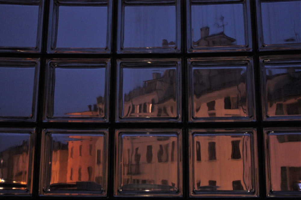 a view of a building through a window at night