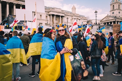 Volunteers distributing campaign materials in a bustling city square, engaging with citizens.